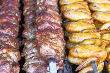 Barbecue meat on wooden skewers on the grill top View, flat layout