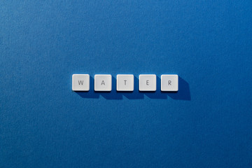 description of the word Water on a blue background