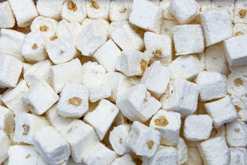 Turkish delight Eastern sweets with nuts in the background for the label