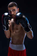 Double arm block. Boxing trainer showing defensive techniques. Combat sport, fight club.