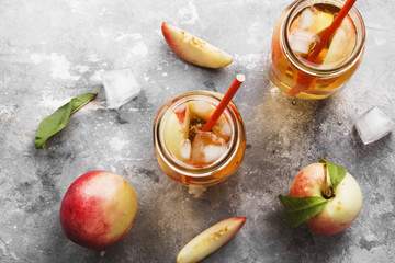 Peach ice tea on a gray background. Top view. Food background