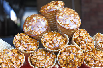 Gozinaky. Candied roasted nuts. Honey bars with peanuts, sesame and sunflower seeds, close-up.