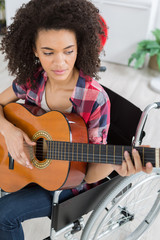 disabled girl playing guitar