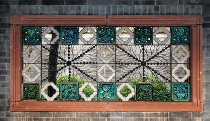 Qinghui Garden is located in Daliang, Shunde, Foshan City, Guangdong Province, China. It is one of the famous representative of Lingnan gardens. Fragment of decor, stained glass window 