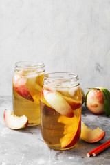 Peach ice tea on a gray background