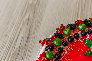 Delicious healthy vegetarian food, do not bake a strawberry cheesecake, decorated with fresh red berries and green mint leaves. Copy space