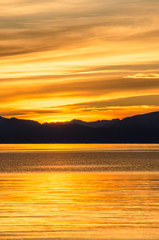 Beautiful sunset above the sea and mountain