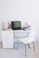 stationery room, table with stationery and laptop. back to school, ready for studying.
