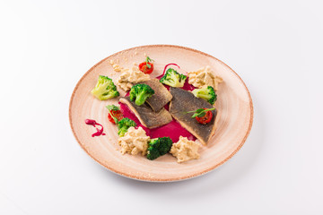 Top and Front View - Trout fillet in cornflakes, red beets broccoli and garlic sauce.