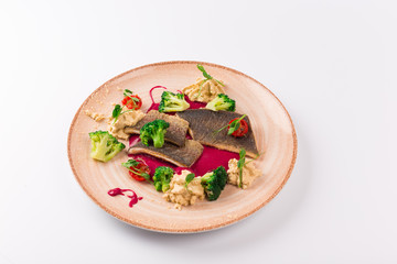 Top and Front View - Trout fillet in cornflakes, red beets broccoli and garlic sauce.