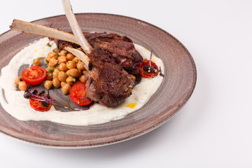 Front and Top view isolated - Lamb chops with tomato sauce sauce.