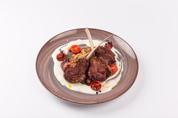Front and Top view isolated - Lamb chops with tomato sauce sauce.