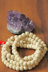 Buddhist beads. Rosary or beads from the sacred tree of Tulasi with a red tassel and and natural...