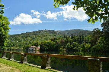 Fototapeta premium Lake Called The Sea With A House On The Other Side Of The Shore In The Beautiful Gardens Of The Farm. Art History Biology. June 19, 2018. La Granja Segovia Spain.