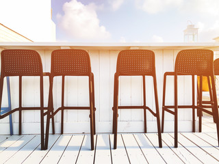 Vacant seats at the open-air bar on the roof