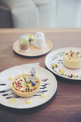 Lemon tart pie topping with chocolate ball sweet dessert on wood background