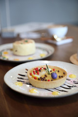 Lemon tart pie topping with chocolate ball sweet dessert on wood background