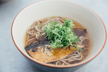 Soba noodles soup with Mackerel or Saba in Japanese on film vintage style japanese food