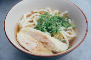 Udon noodles with fried shrimp tempura Japanese food