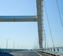 The navigable arch of the Crimean bridge. Arch of the highway and railway section of the Crimean bridge. Driving along the Crimean bridge. A grandiose building of the 21st century. The new bridge.