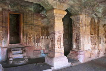 Cave 4 : Interior view. The figure of Mahavira in the sanctu is partially seen, Jaina Tirthankara images engraved on the pillars and on the walls are also seen.