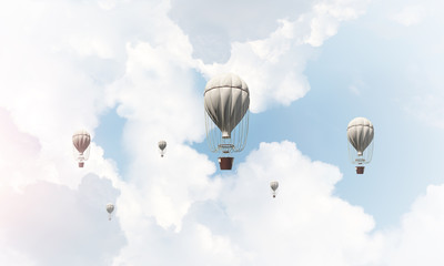 Flying hot air balloons in the air.