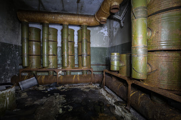 Old rusty air filtration and ventilation system in abandoned Soviet bunker