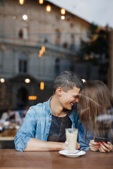 Happy and loving couple face to face  in a big city street