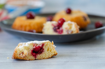 Slices of fresh iced sponge cake with cherries