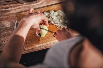 Woman cutting onion