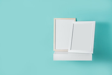 Frame mockup on turquoise wall. Copyspace.

