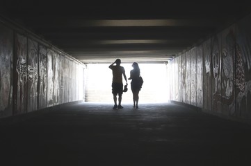 Young couple in an undrground passage