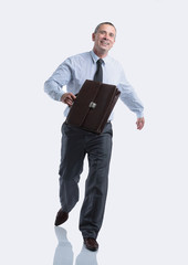 modern business man with a briefcase going forward