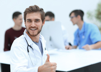 smiling doctor showing thumb up