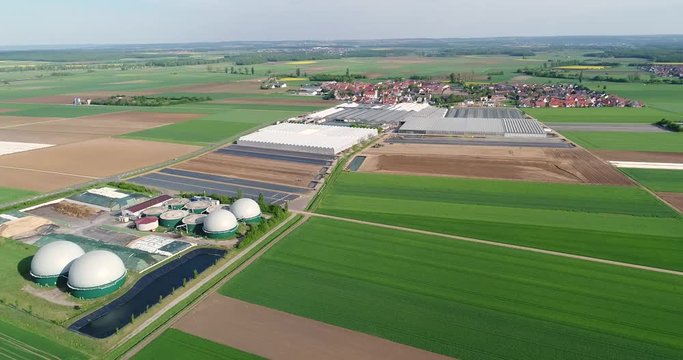 Aerial video of Biogas plant. The agricultural and greenhouse complex is equipped with its own biogas for the production of biogas, Europe