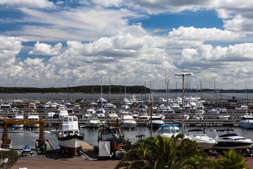 Fototapeta na wymiar Port and harbour with blue sky and white clouds above