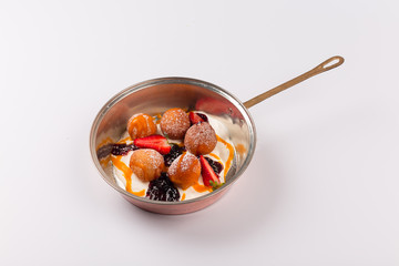Front and top view isolated Dessert - Cheese pancakes with sour cream and cranberry juice and strawberry puree.