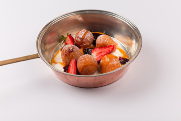 Front and top view isolated Dessert - Cheese pancakes with sour cream and cranberry juice and strawberry puree.