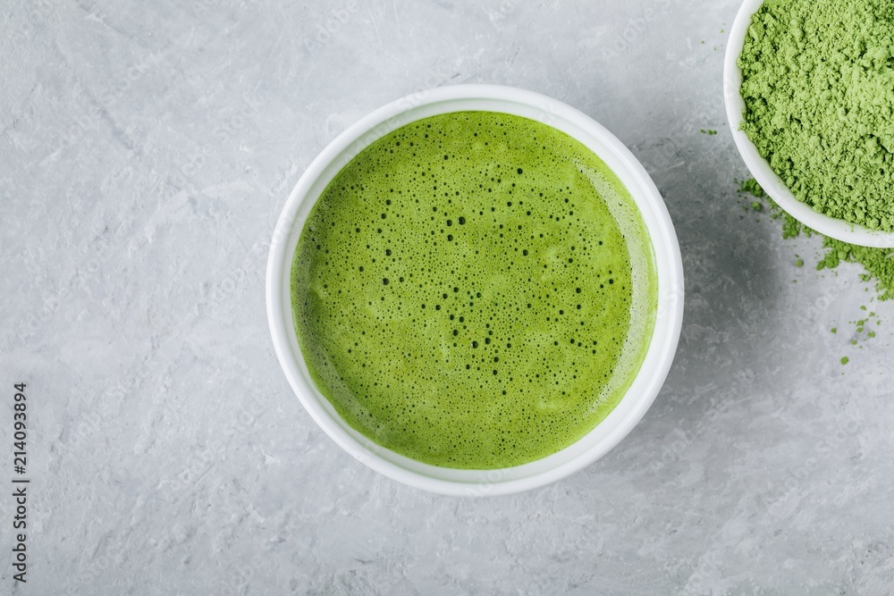 Canvas Prints Japanese matcha green tea latte in white bowl on gray background