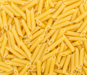 Raw pasta as food background. Top view.
