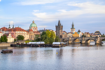 Obraz na płótnie Canvas View to the Charles Bridge and St. Nikolaus Church in Prague