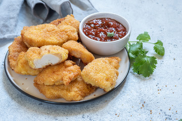 Fried crispy chicken nuggets with sauce