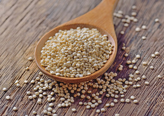 quinoa seeds on wooden background