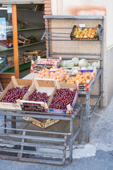 Display of fruits with apricots, cherries, melons and tomatoes