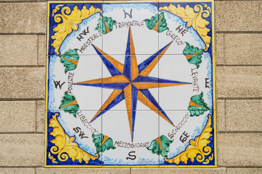 Ceramic compass rose indicating the cardinal points and the direction of the eight winds