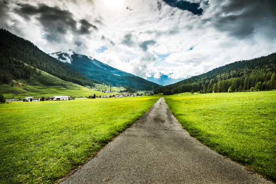 Rural road ito mountain village in Switzerland