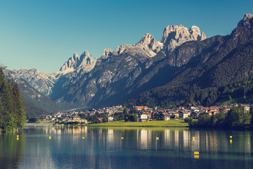 Beautiful mountain village landscape of Villapiccola and Lake Auronzo in Italy.