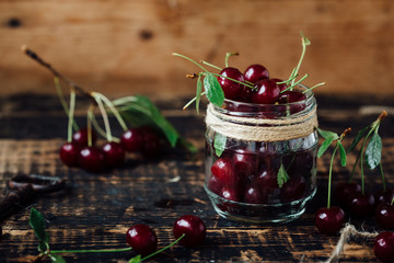 Fresh ripe cherries on a wooden table. Wooden background