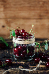 Fresh ripe cherries on a wooden table. Wooden background