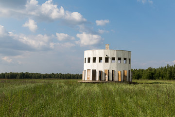 Russia, Nikola-Lenivets. White wooden rotunda with many doors in the Art Park Nikola Lenivets....